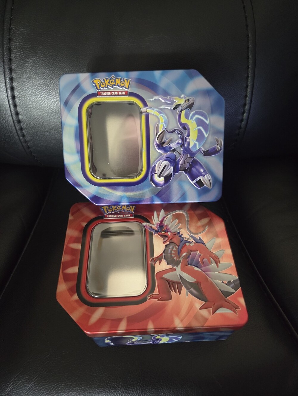 Pokémon Tin Set Koraidon and Miraidon With 300 Holo/Reverse Trading Cards